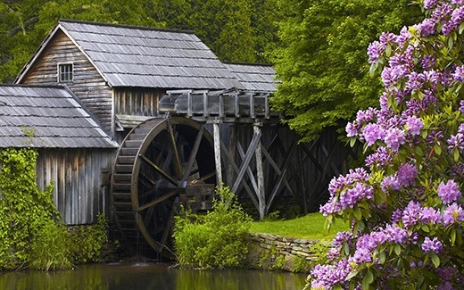 Wooden house with water wheel